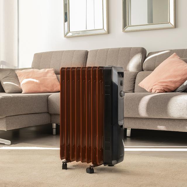 Cecotec ReadyWarm 9000 Space Black Radiador de aceite de 9 módulos y 2000W con 3 niveles de potencia cobertura de 20 m² recogecables control sencillo asa ruedas y doble sistema de seguridad. Radiador de aceite Devoluciones gratuitas